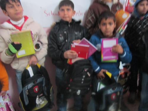 Yatma children with new school supplies